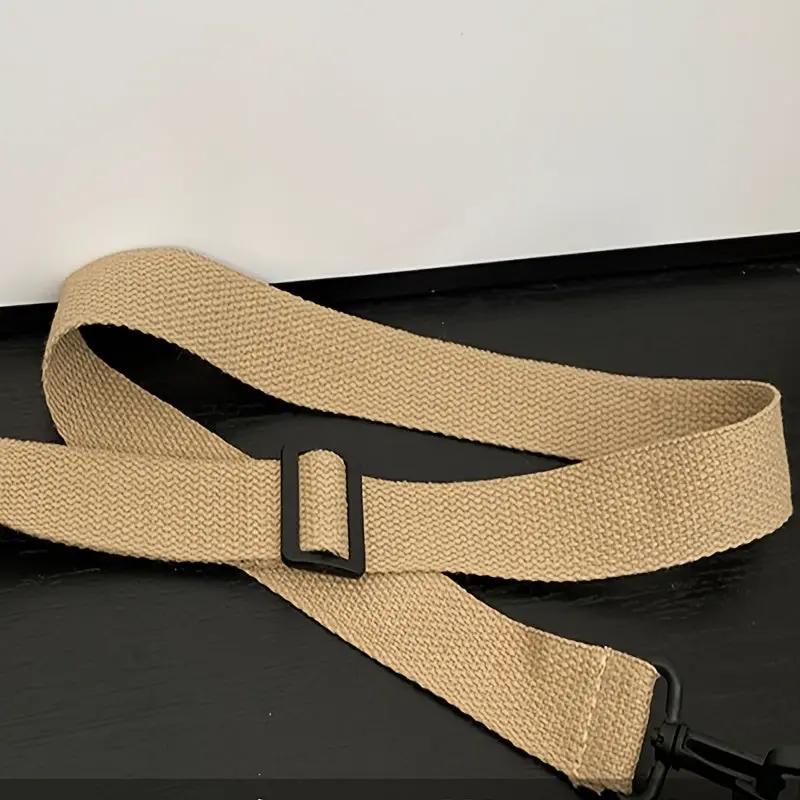 Beige nylon crossbody bag strap with removable design and black plastic buckle