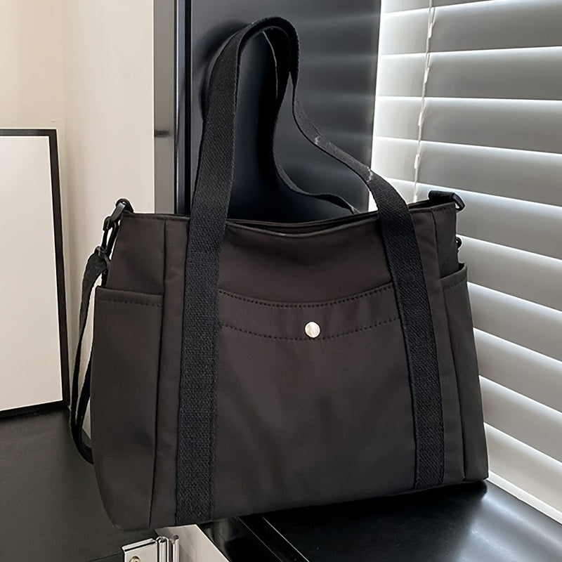 Large capacity black nylon crossbody bag with removable strap and top handles