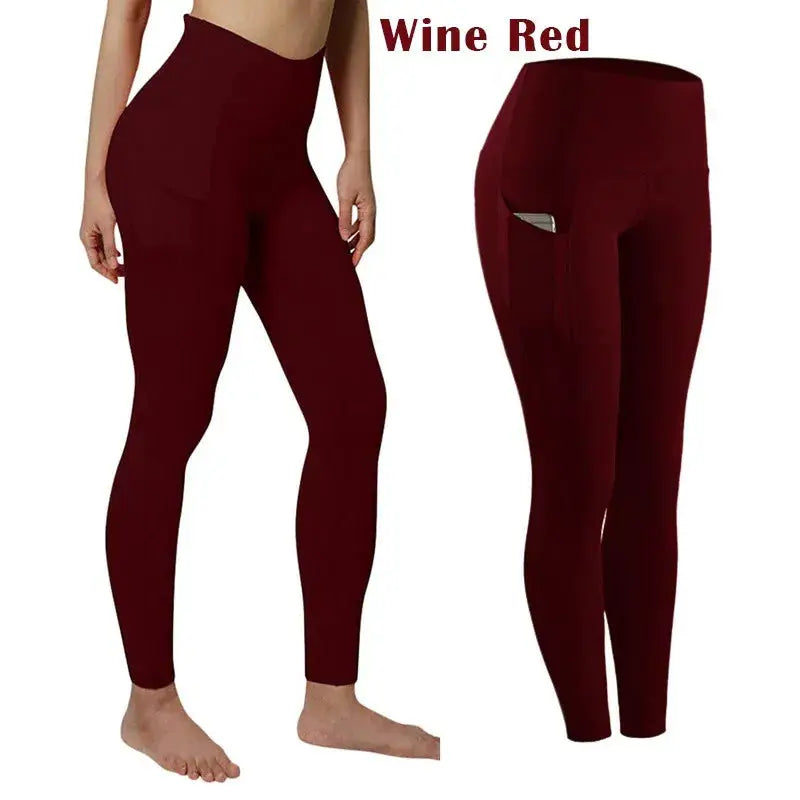 Wine red high-waist women's yoga leggings with pockets for tummy control.