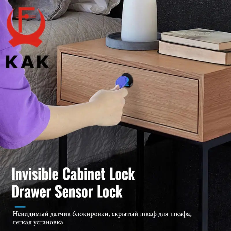 KAK electronic cabinet lock with RFID; blue keycard used on wooden bedside drawer.