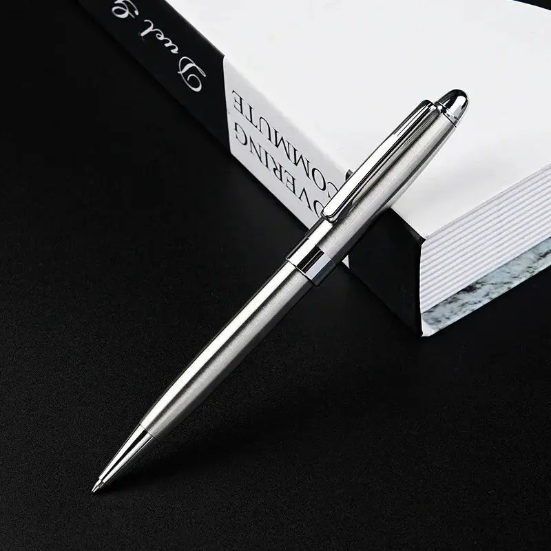 Ballpoint pen with silver metal body and chrome clip; retractable, smooth writing signature pen