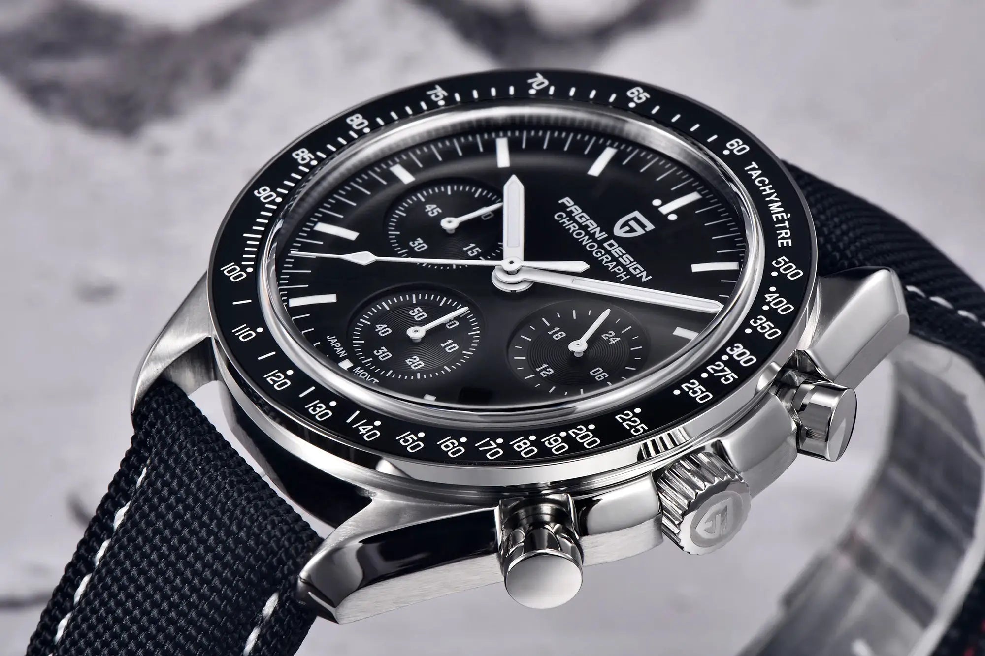 PAGANI DESIGN men's chronograph watch with black dial, tachymeter bezel, stainless steel case, and black fabric strap.