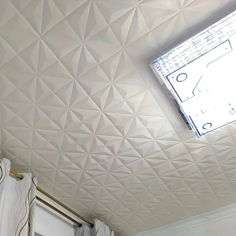 White 3D foam ceiling tiles with geometric star pattern; self-adhesive, waterproof decor.