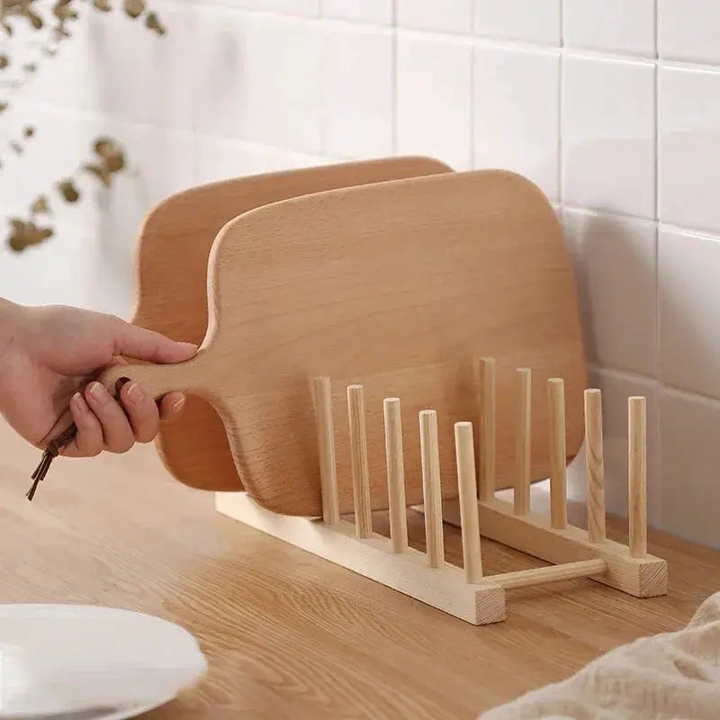 Simples Market wooden dish drying rack with peg slots for plates and a cutting board.