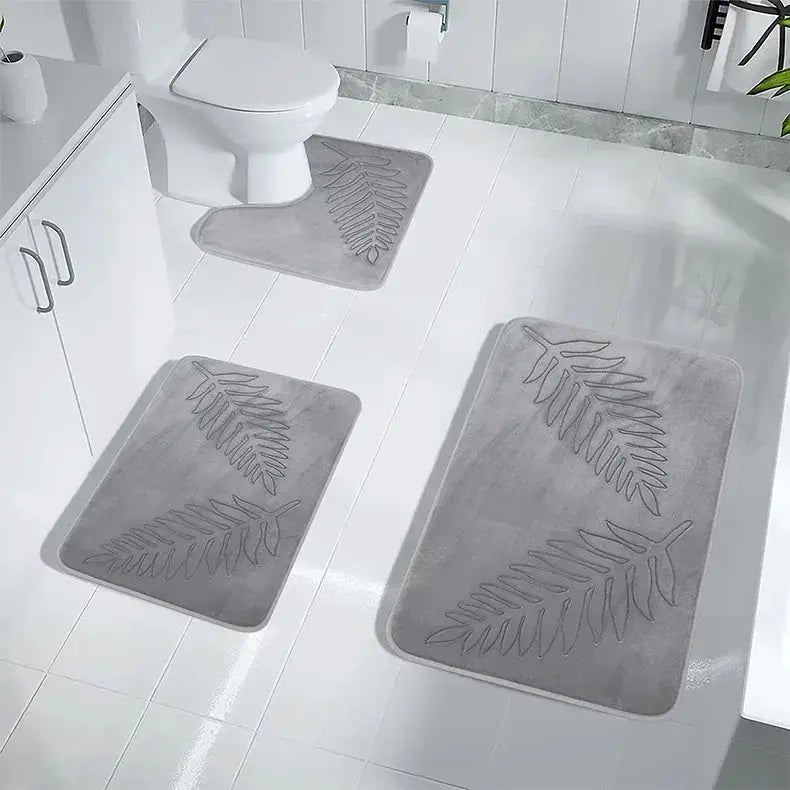 3-piece memory foam bathroom mat set by Simples Market in grey with leaf pattern.