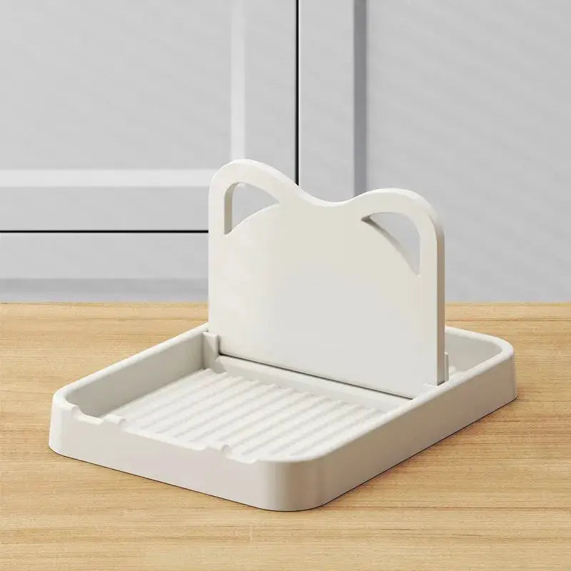 Simples Market white cat-ear plastic utensil holder for spatulas and pot lids on a kitchen countertop