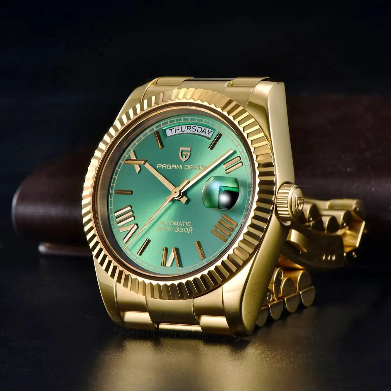 Pagani Design DD36 gold-tone men's watch with green dial, day-date window, fluted bezel, and stainless bracelet