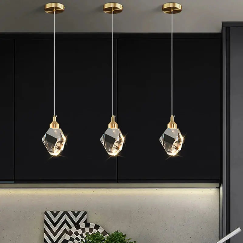 Simples Market ceiling pendant lamp set of 3 with gold fixtures and crystal pendants over black kitchen cabinets