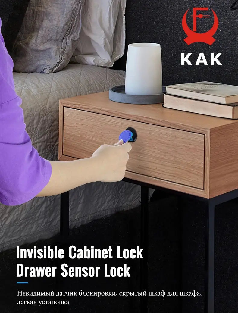 KAK Invisible Cabinet Lock on a wooden bedside drawer, blue RFID sensor key inserted