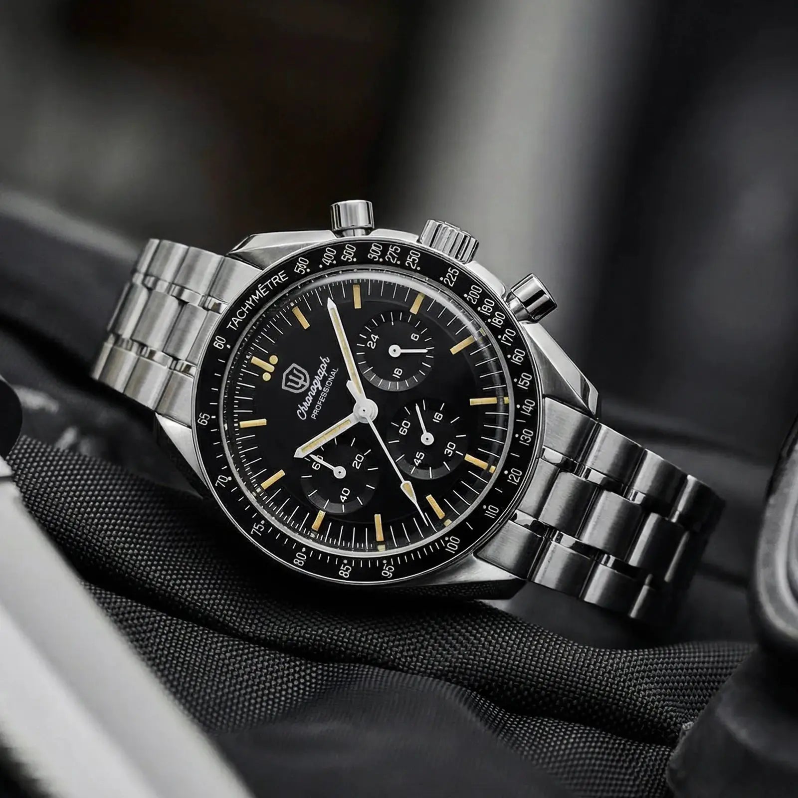 Watchdives WD1863 chronograph watch with stainless steel bracelet, black dial, and tachymeter bezel
