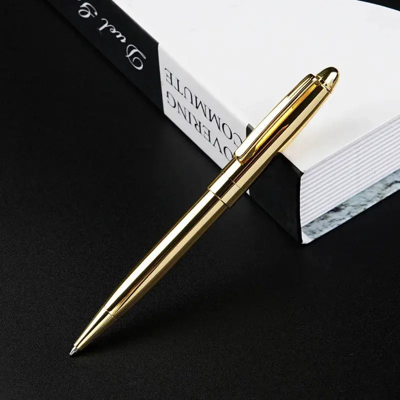 Simples Market gold-tone retractable ballpoint pen with clip.