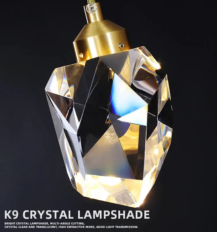 Simples Market crystal pendant lamp with gold-tone mount and multifaceted K9 crystal shade, modern ceiling chandelier.