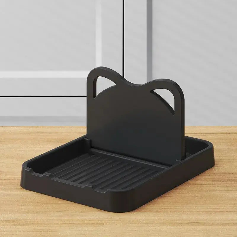Cat ear utensil holder by Simples Market, black plastic with a ribbed tray for spatulas and pot lids