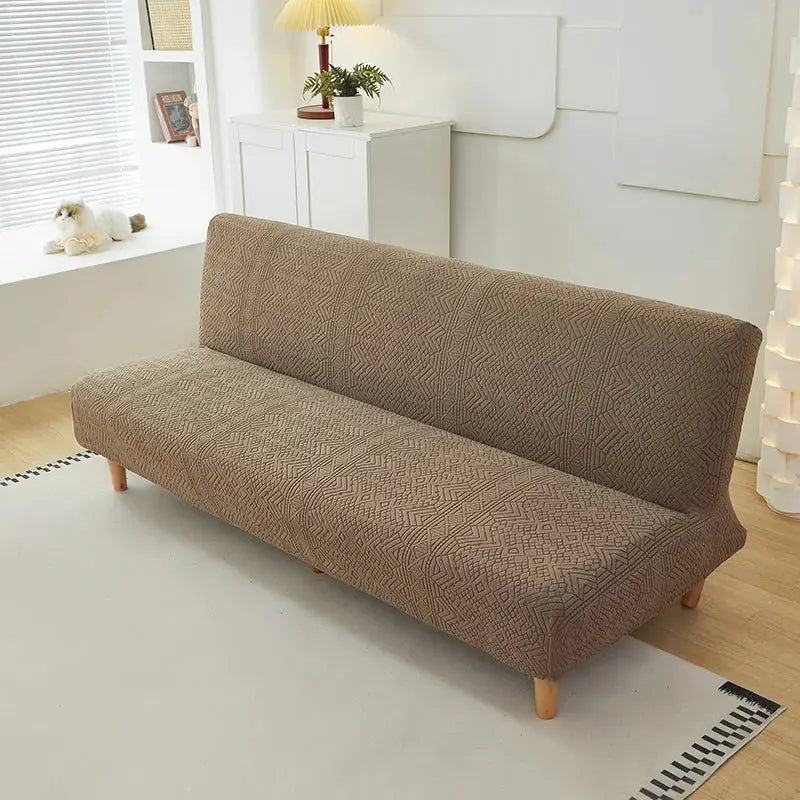 Simples Market one-piece stretch jacquard sofa bed cover in brown geometric pattern on a living room sofa.