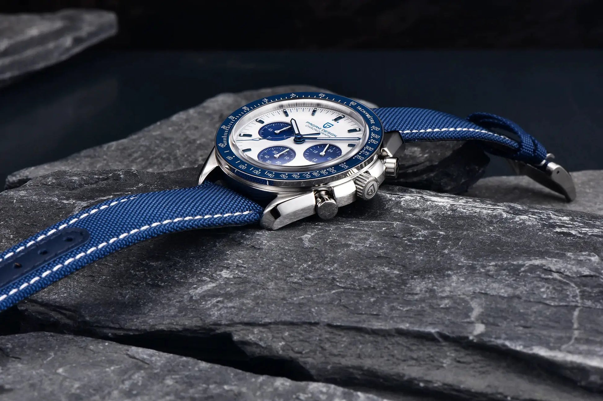 Pagani Design men's chronograph watch with white dial, blue bezel and blue fabric strap.