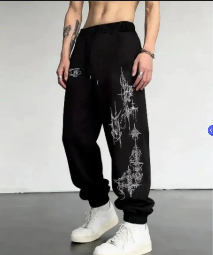 Men's black joggers with spiked cross print on the leg, drawstring waist, cuffed ankles by Simples Market