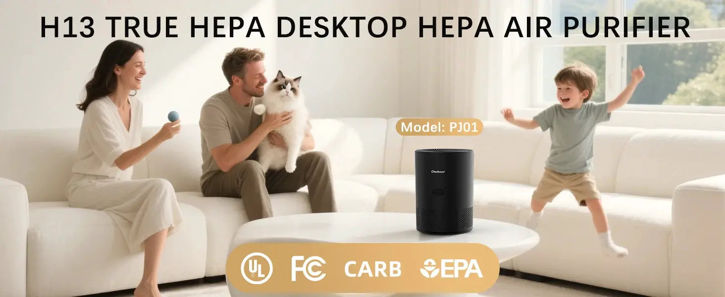 Chuboor H13 true HEPA desktop air purifier, black PJ01 model on a white coffee table with a happy family