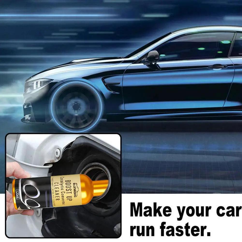 Simples Market catalytic converter cleaner spray being used on car exhaust; orange bottle with black label.