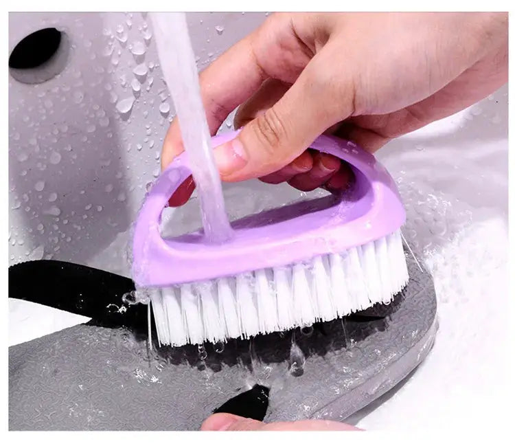 Simples Market egg-shaped cleaning brush, purple handle with white bristles, versatile cleaning tool.