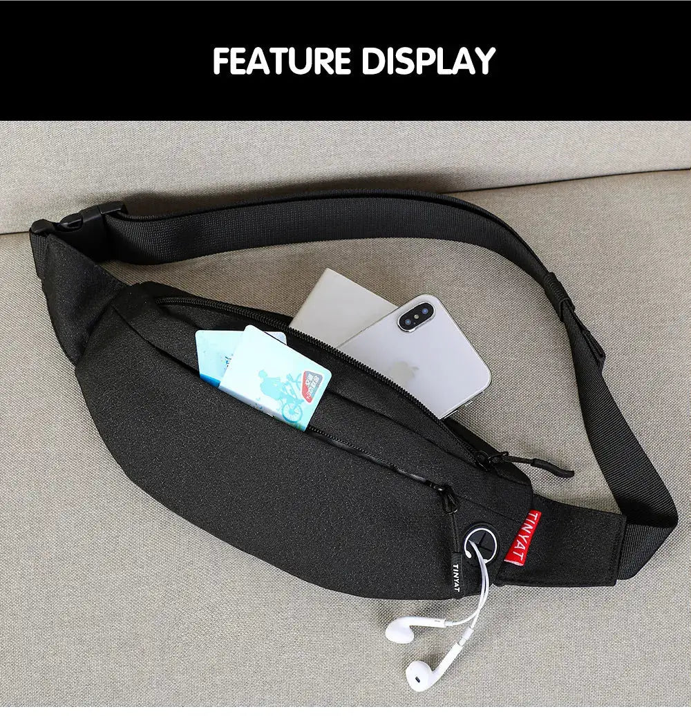 TINYAT black waist bag with adjustable strap; front pocket holds phone and cards, earphones shown.