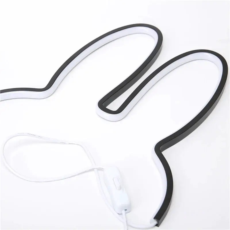 Rabbit LED night light USB desk lamp by Simples Market, black-and-white loop design for kids' room.