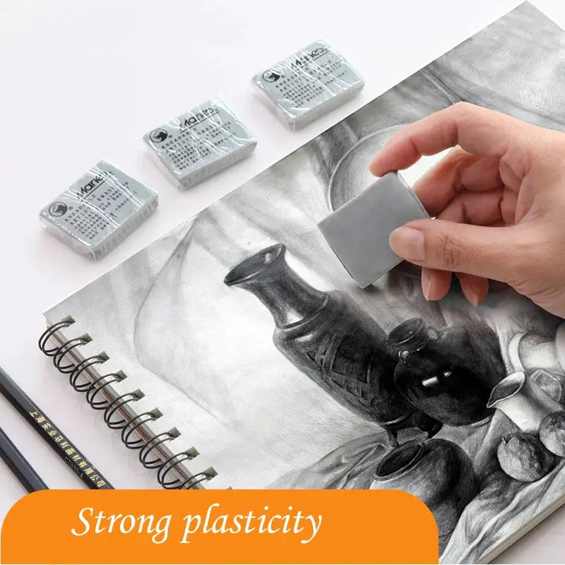Soft gray rubber eraser by Simples Market for drawing; multiple erasers shown