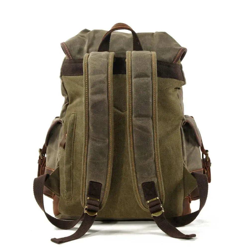 Vintage canvas backpack, olive green with brown leather straps, men's travel rucksack