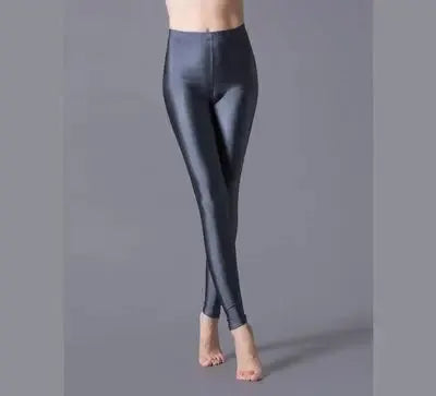 Women's shiny leggings by Simples Market, black metallic spandex with high elasticity.
