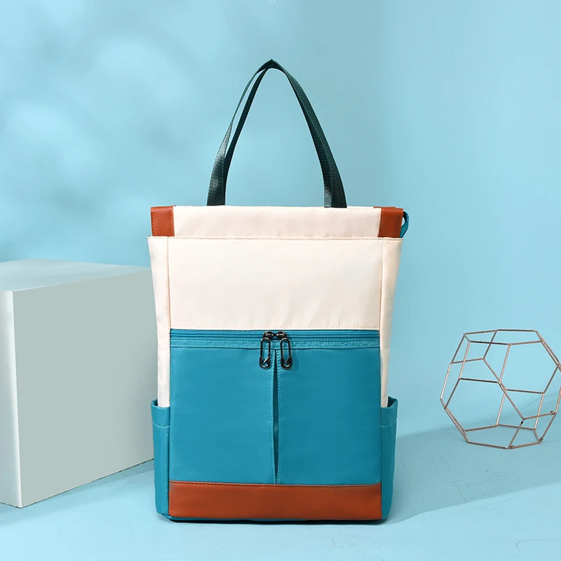 Women’s waterproof Oxford backpack with cream body and blue front pocket