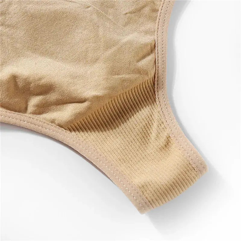 Beige G-string thong underwear close-up with ribbed waistband