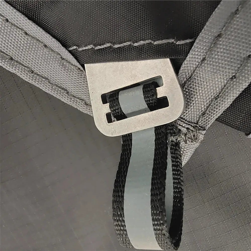 Waterproof camping mat with grey fabric and metal buckle strap for portable travel use