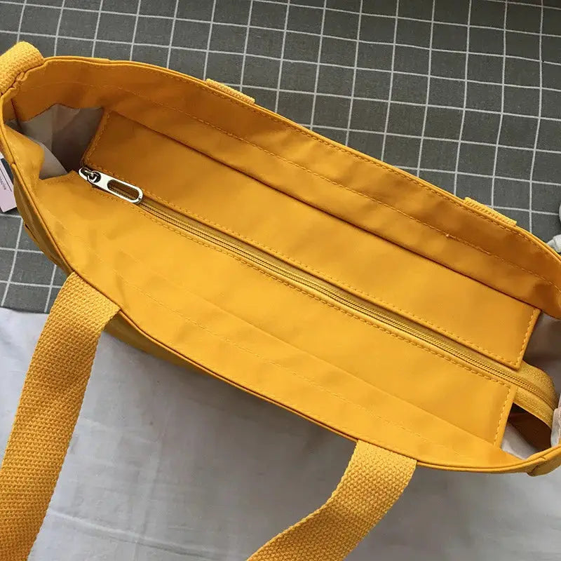 Waterproof Oxford large-capacity women handbag by Simples Market, yellow tote/shoulder bag.