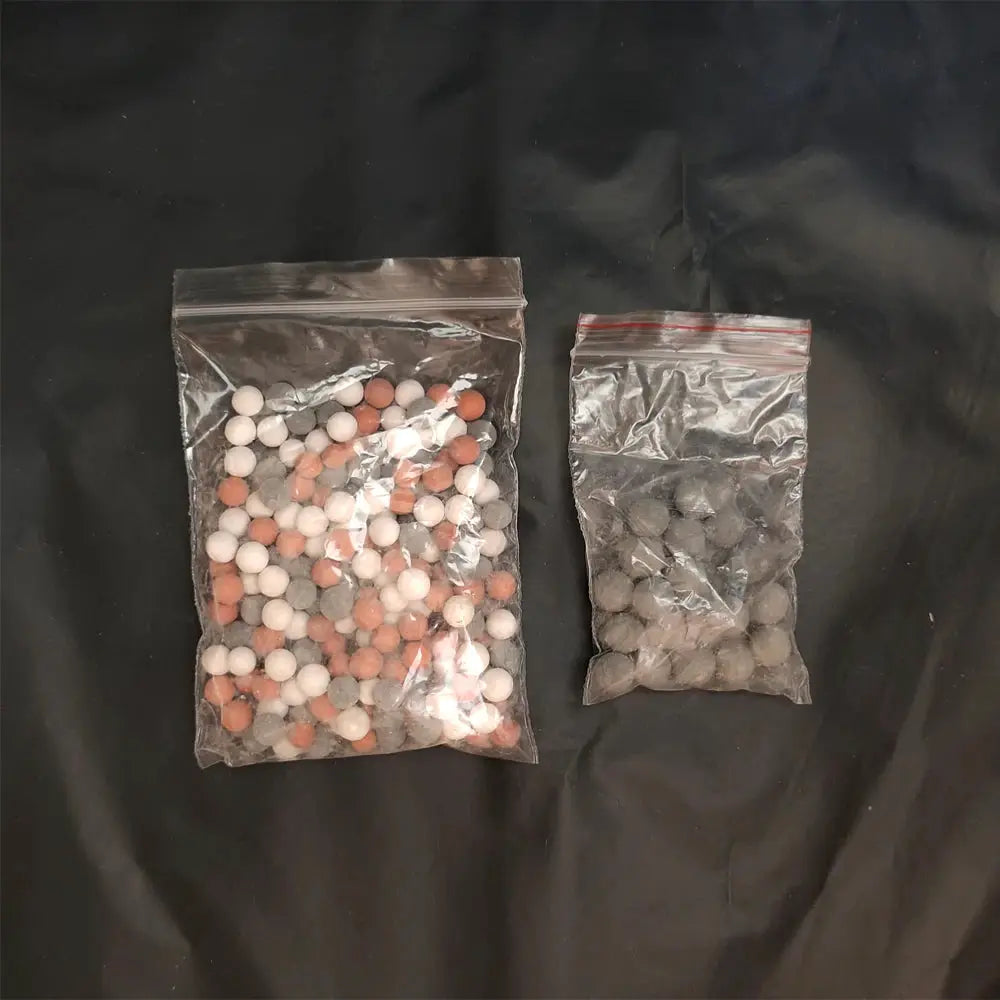 Shower head replacement beads by Simples Market; ceramic ion-mineralized balls in two bags (white, peach, gray)
