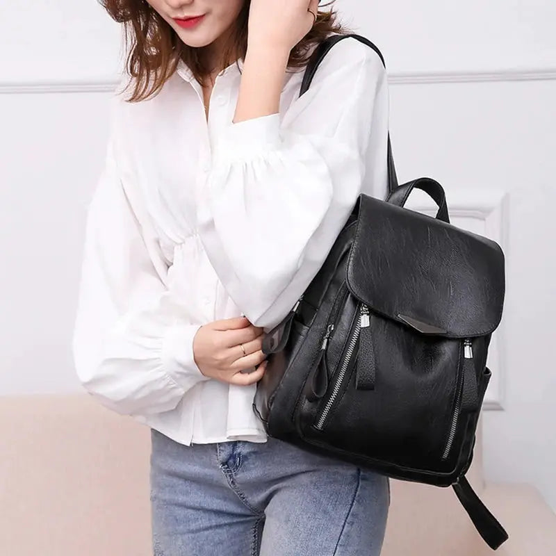 Yogodlns luxury womens backpack in black PU leather with flap, double zippers and roomy main compartment