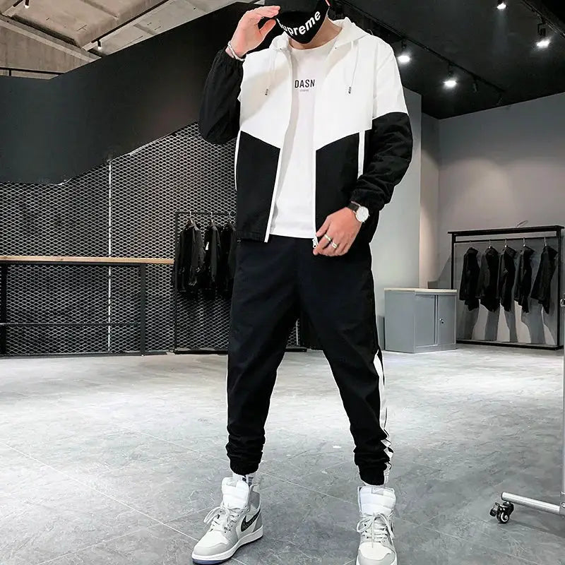 Men's 2-piece tracksuit set: white and black hooded jacket with matching jogger pants, white sneakers, Supreme mask