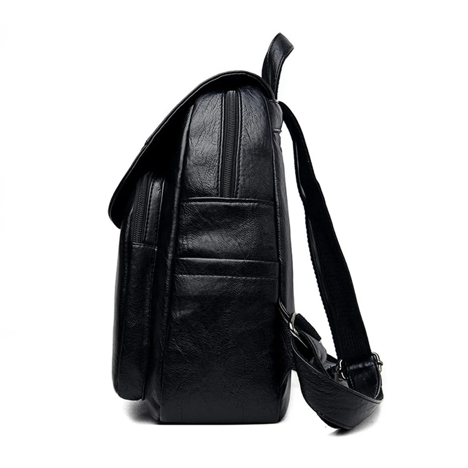Women’s genuine leather backpack, black, with front pocket and zip compartments; adjustable shoulder straps.