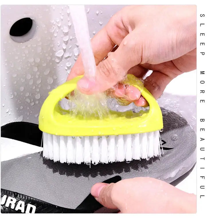 Egg-shaped yellow cleaning brush with soft white bristles, multipurpose bathroom and shoe scrubber.