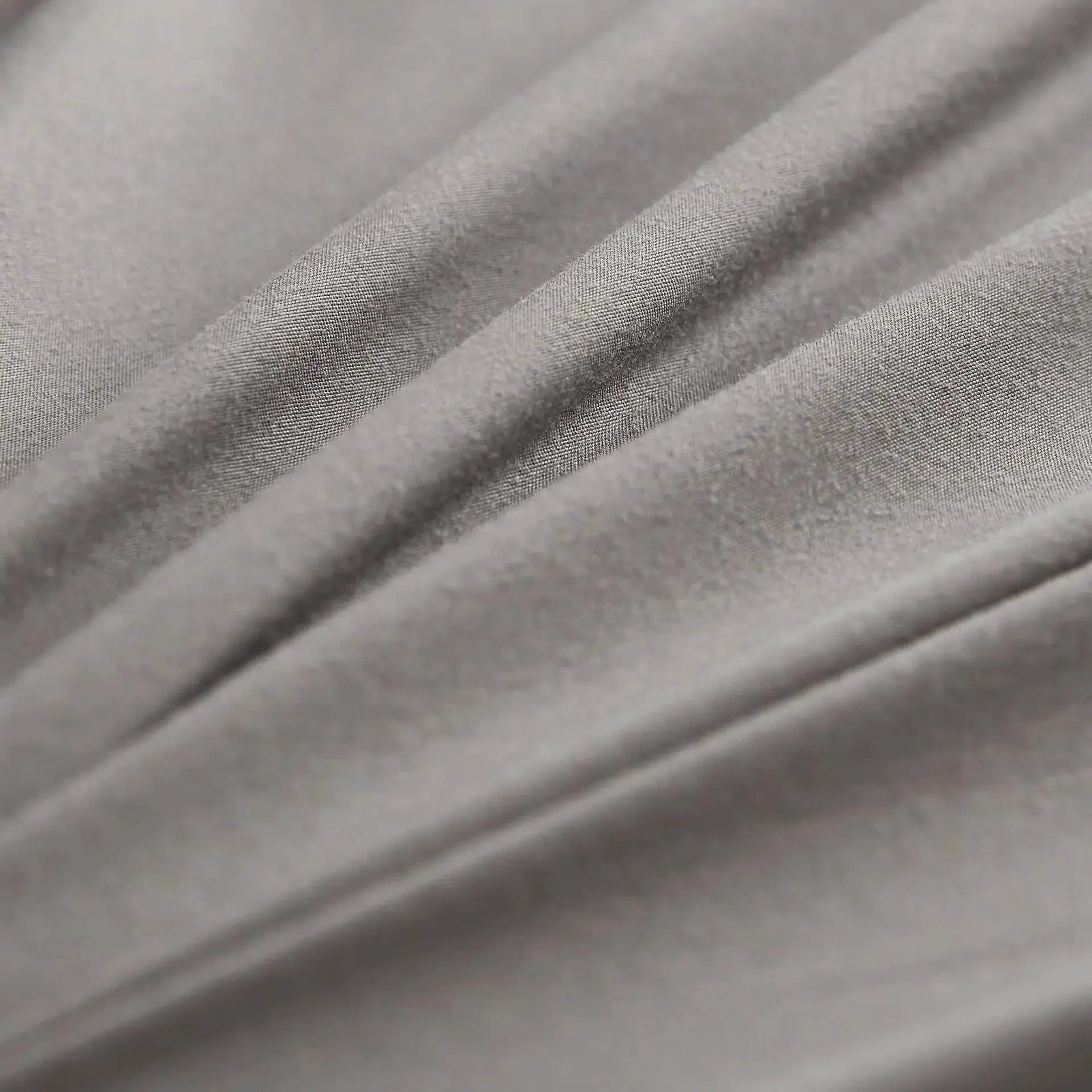 6-Sides Fully Enclosed Waterproof Mattress Cover fabric close-up in gray; woven textured textile