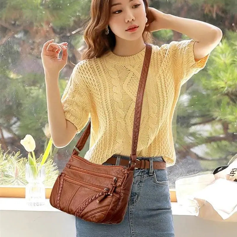 Simples Market women's brown leather-feel PU messenger bag with braided detailing and crossbody strap.