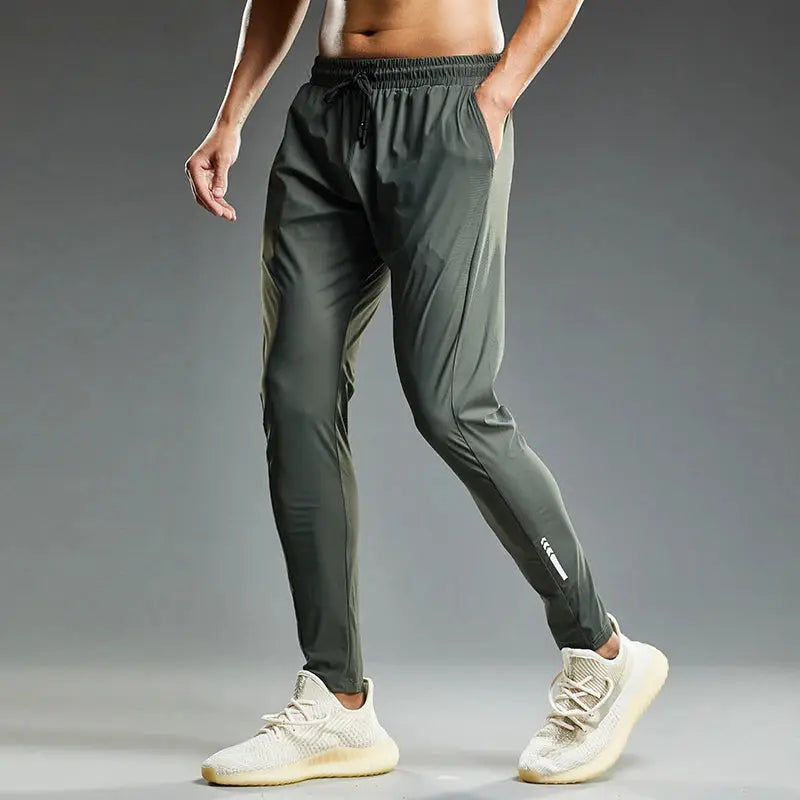 Men's running pants by Simples Market in olive green with elastic drawstring waist