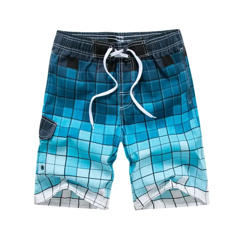 Men's surf board shorts by Simples Market in blue gradient plaid with white drawstring and side pocket