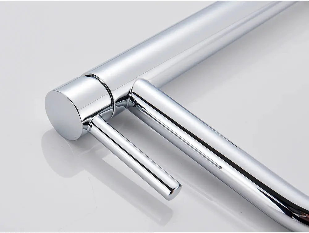 Chrome bathroom basin faucet with dual lever handles and modern cylindrical body