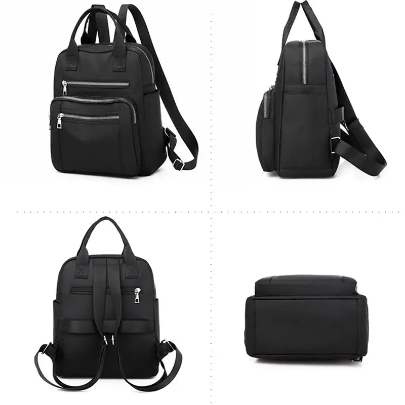 Women black Oxford backpack with multiple zip pockets, top handles, and adjustable shoulder straps.