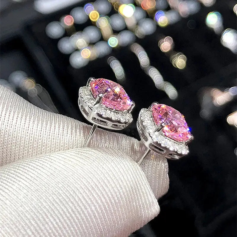 Huitan cushion-cut pink cubic zirconia stud earrings with a halo of clear stones in silver-tone metal; pair