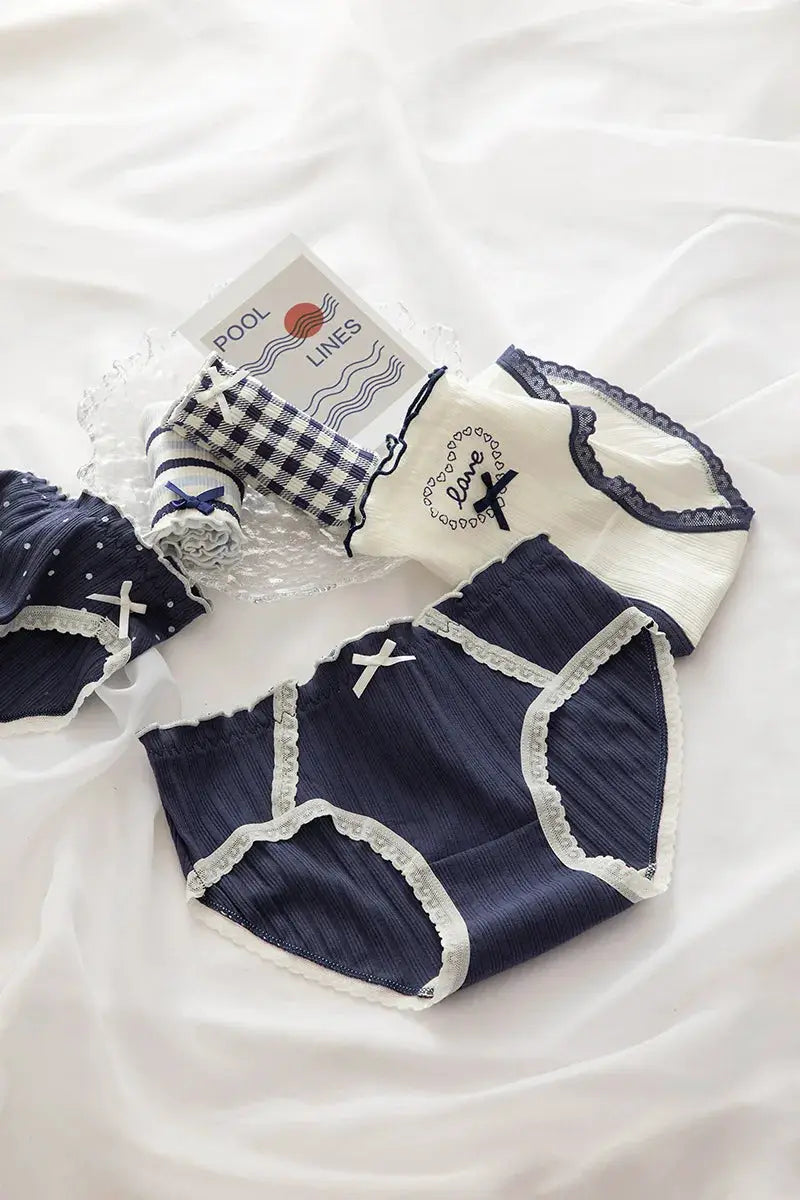 Cotton women's underwear set in navy and white with bow accents and lace trim