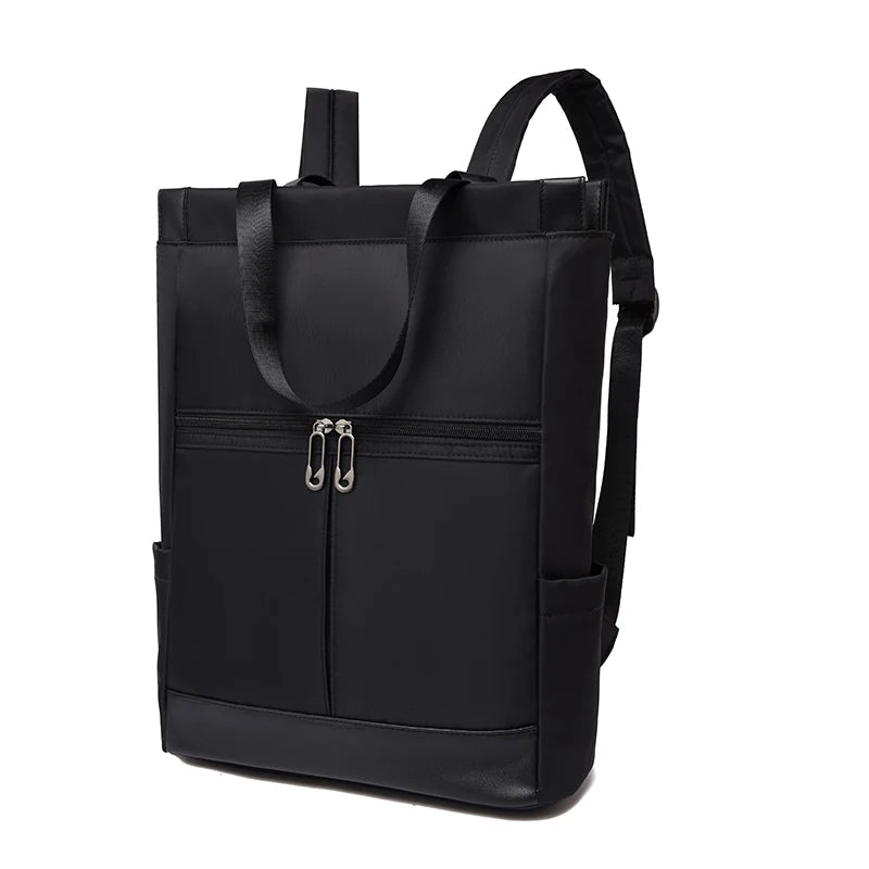 Black waterproof Oxford backpack with front dual-zippered pocket, top handles, and side pockets.