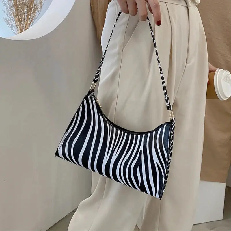 Zebra print PU leather shoulder bag for women with black-and-white striped strap