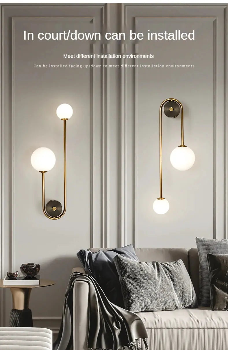 Simples Market modern wall lamp with glass ball shades in gold finish; pair for living room.