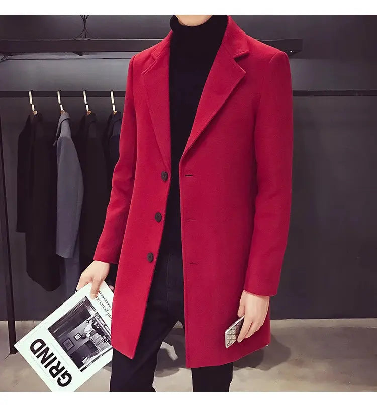 Men's long red wool-blend coat; slim casual business style on model wearing black turtleneck, holding a magazine.