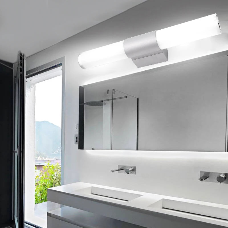 Bathroom LED wall lamp bar, white cylindrical tube with metal mount, mounted above a modern bathroom mirror